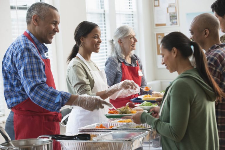 Volunteers serving food AGBEF